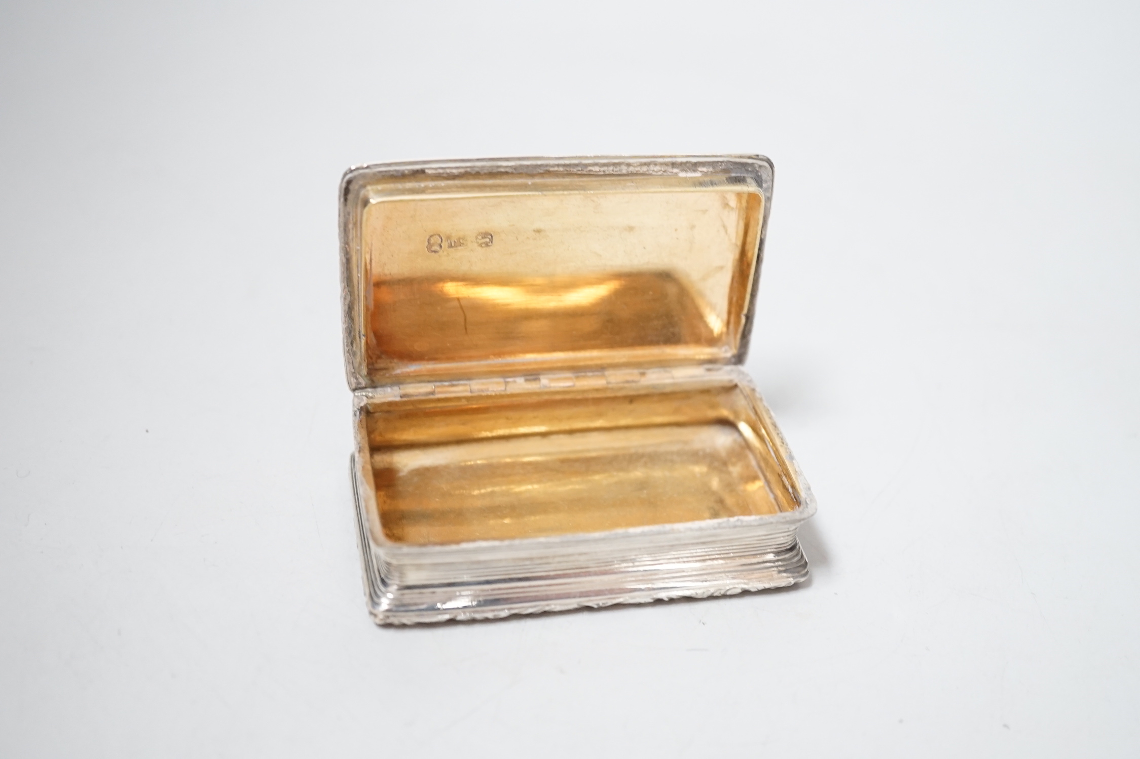 A George IV engine turned silver rectangular snuff box, with engraved inscription, Thomas Shaw?, Birmingham, 1823, 73mm.